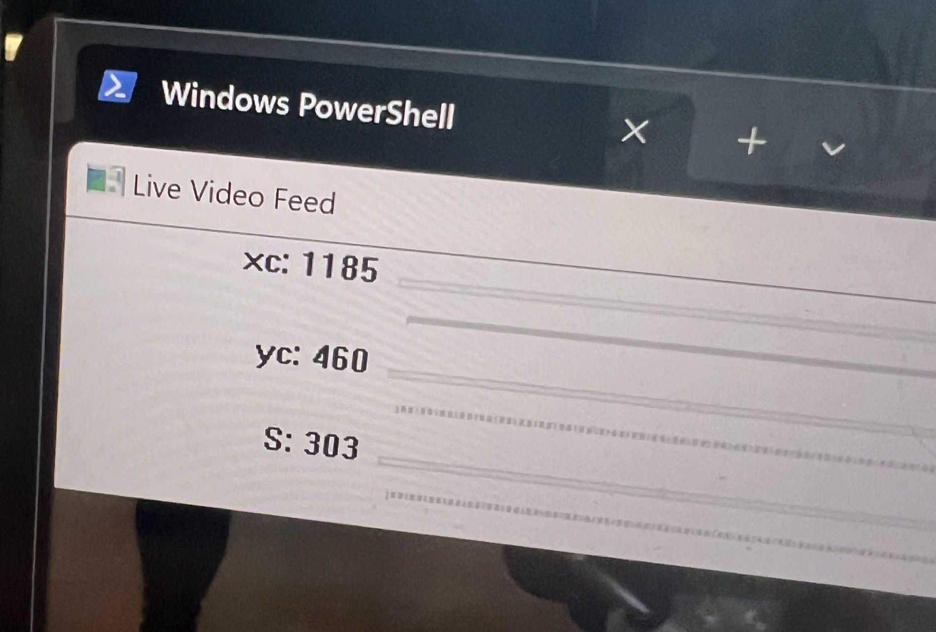 The live alignment readout showing xc, yc and S values over the camera feed
