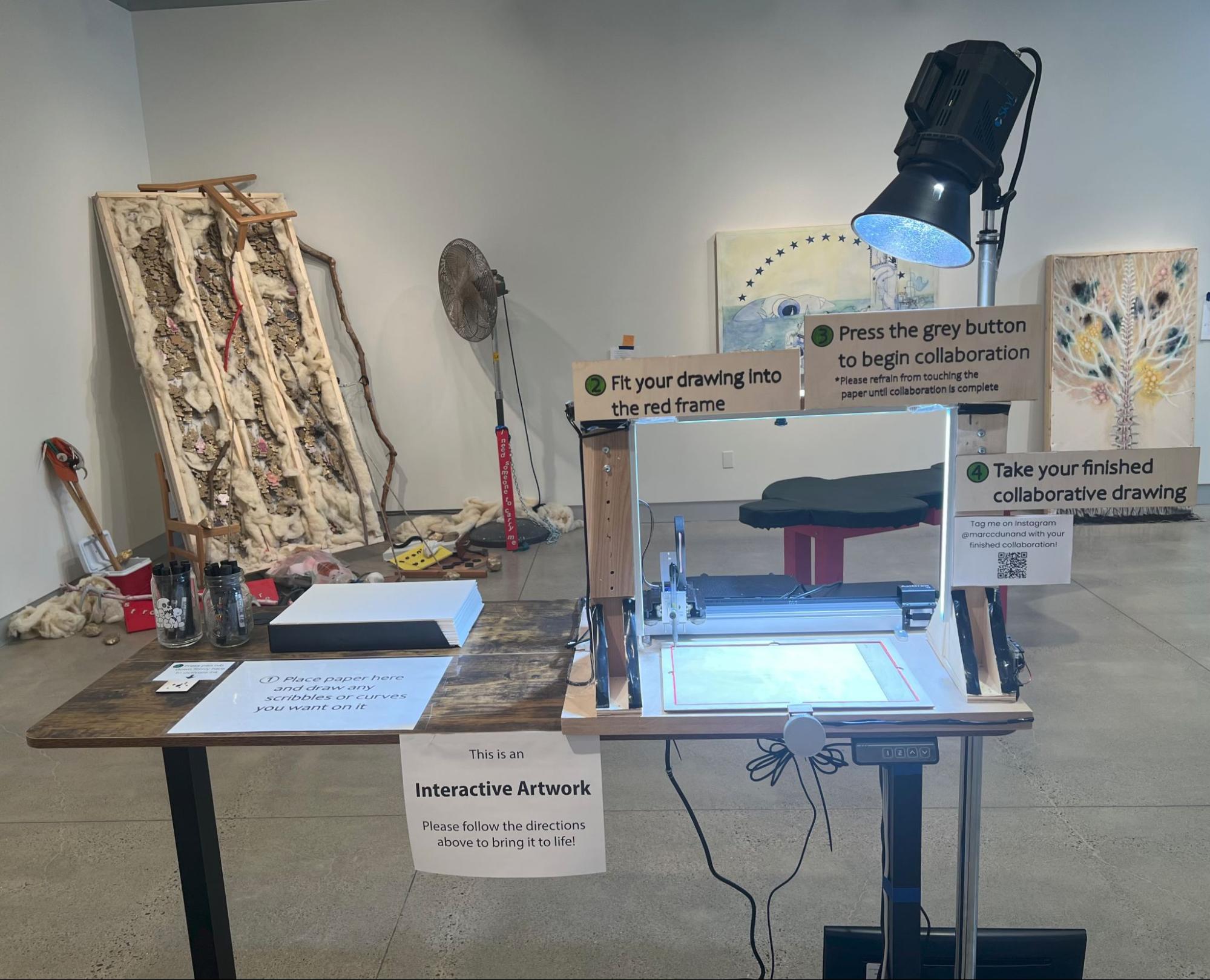 The installation in the gallery, with its numbered stations laid out left to right along a table