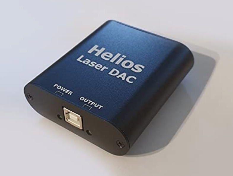 The Helios Laser DAC, a small blue anodized box with a USB port