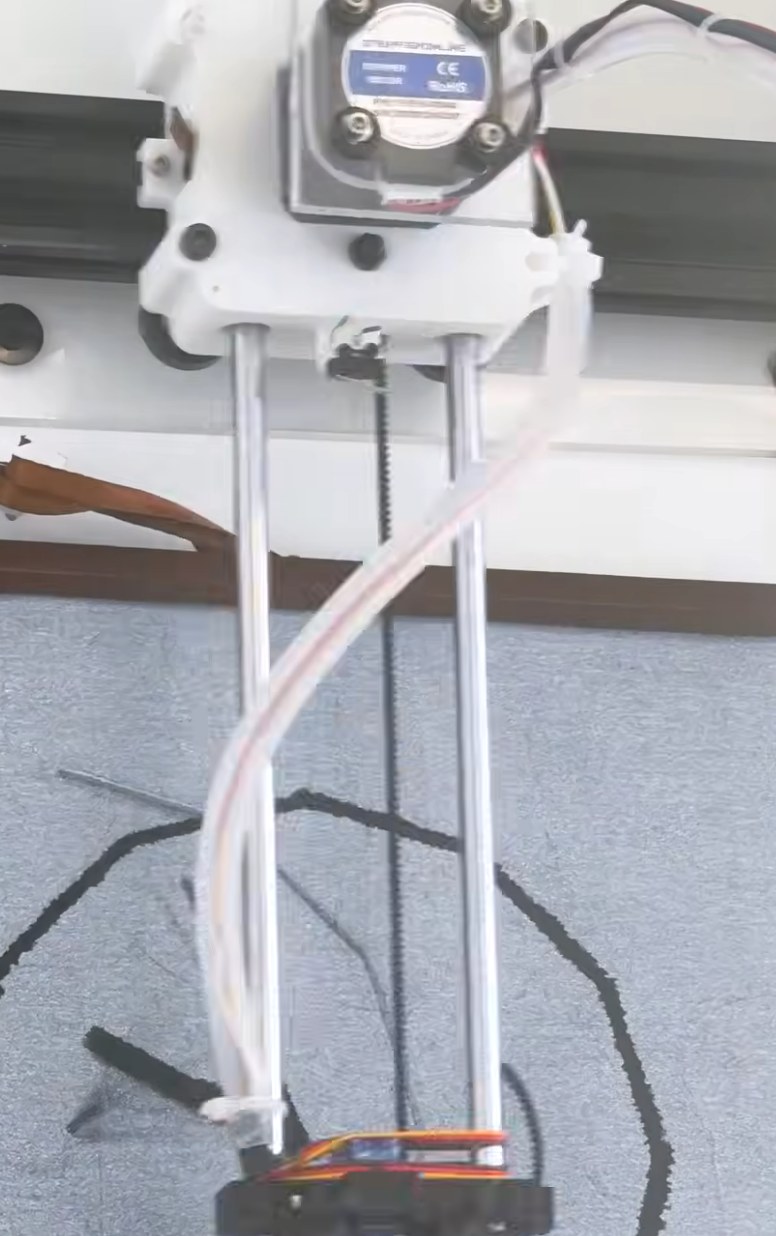 The wire tubing running down the y-arm