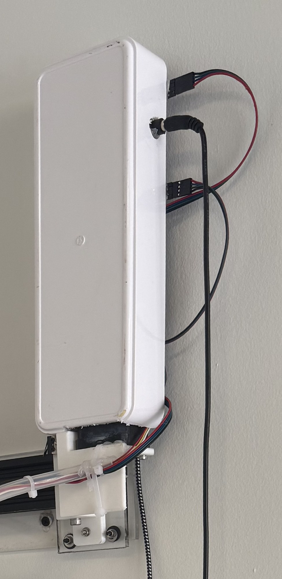 The white box housing the electronics, mounted beside the plotter