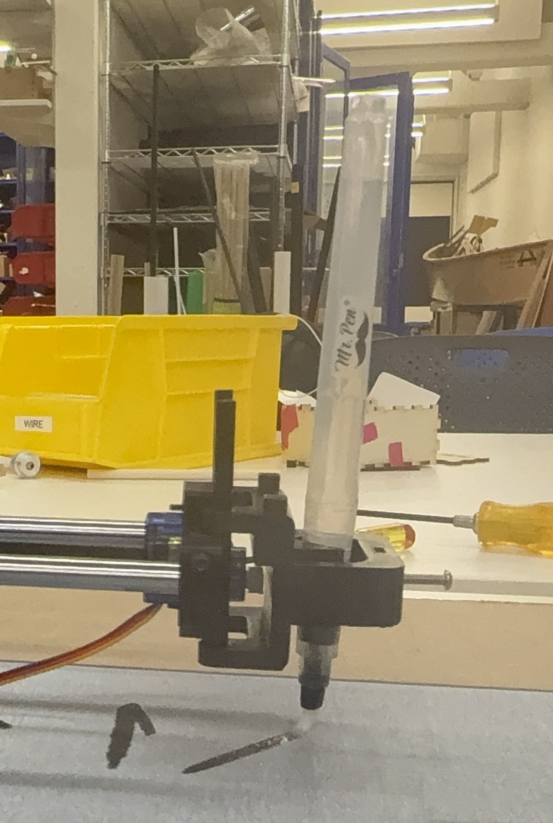 The plotter with a standard water calligraphy brush in its pen holder